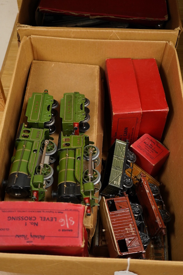 A collection of Hornby clockwork tinplate 0 gauge railway, including; two LNER 0-4-0 tender locomotives, both 1842, (No.501), together with six 4-wheel wagons and coaches, a boxed No.3 Station, level crossing, signal cab